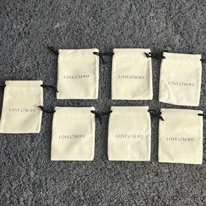 NWT set of 7 Love Aero from Louise Carter suede jewelry bags